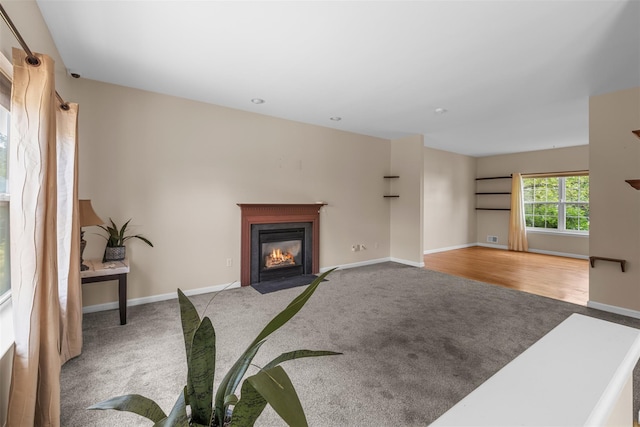 9 June Rd, Chester, NY 10918 - unfurnished living room with carpet and a fireplace with flush hearth