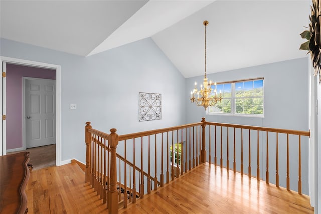 9 June Rd, Chester, NY 10918 - hallway featuring an upstairs landing, a chandelier, vaulted ceiling, and wood finished floors