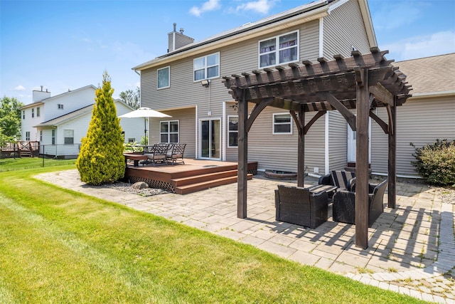 9 June Rd, Chester, NY 10918 - back of house with a pergola, a deck, an outdoor living space, a lawn, and a chimney