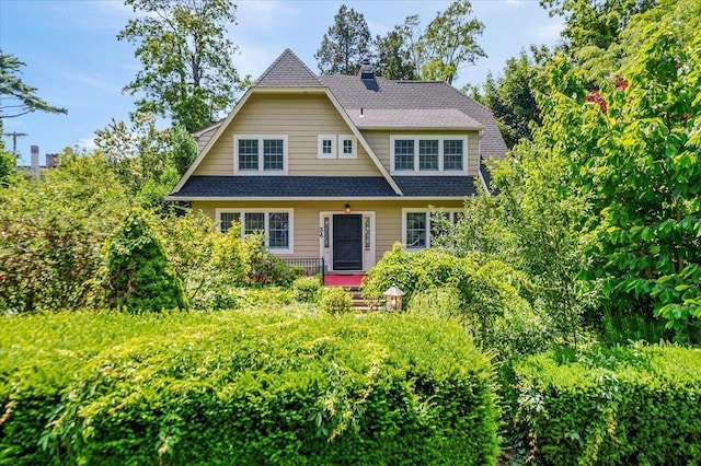 34 Elm St, Great Neck, NY 11021 - view of front of house with a chimney and a shingled roof