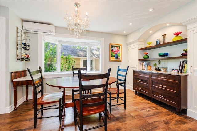 34 Elm St, Great Neck, NY 11021 - dining area with an AC wall unit, wood finished floors, a chandelier, and recessed lighting