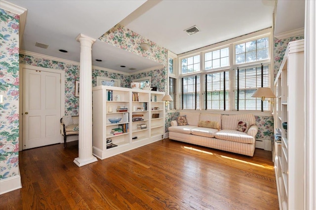 34 Elm St, Great Neck, NY 11021 - living area with wallpapered walls, decorative columns, wood finished floors, and ornamental molding