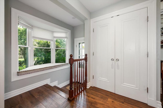 34 Elm St, Great Neck, NY 11021 - foyer entrance with baseboards and dark wood-style flooring