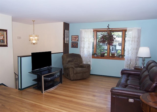 242 Wyandanch Rd, Sayville, NY 11782 - living area featuring light wood-style floors and a chandelier