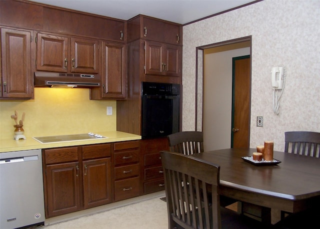 242 Wyandanch Rd, Sayville, NY 11782 - kitchen with stainless steel dishwasher, oven, electric cooktop, under cabinet range hood, and light countertops