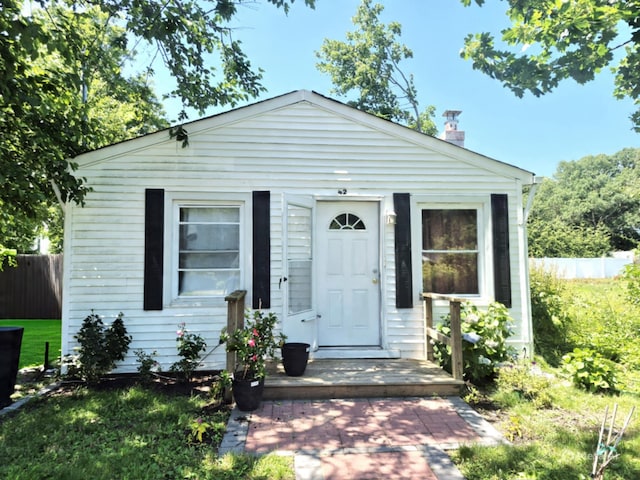 42 Oak Dr, Riverhead, NY 11901 - view of front facade with a chimney