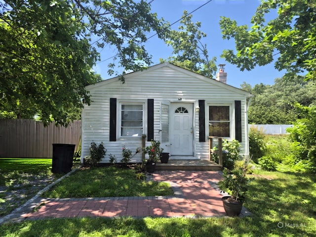 42 Oak Dr, Riverhead, NY 11901 - view of front of property featuring a chimney