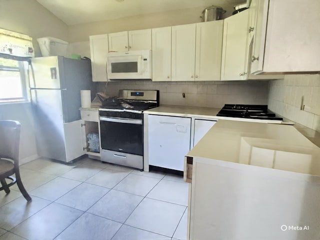 42 Oak Dr, Riverhead, NY 11901 - kitchen featuring white appliances, decorative backsplash, light countertops, and white cabinetry