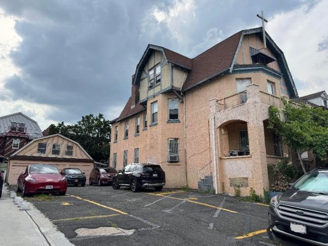 41-24 41-28 76th St, Elmhurst, NY 11373 - view of property with uncovered parking