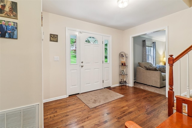 10 Jennifer Ln, Carmel, NY 10512 - entrance foyer with healthy amount of natural light, wood finished floors, stairway, and a baseboard radiator