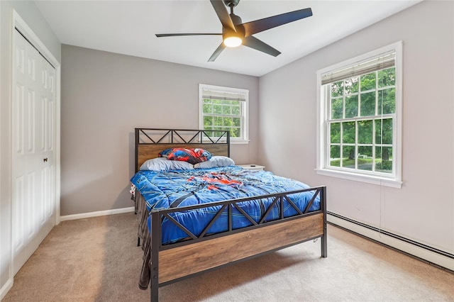 10 Jennifer Ln, Carmel, NY 10512 - bedroom featuring a baseboard heating unit, carpet floors, a closet, and ceiling fan