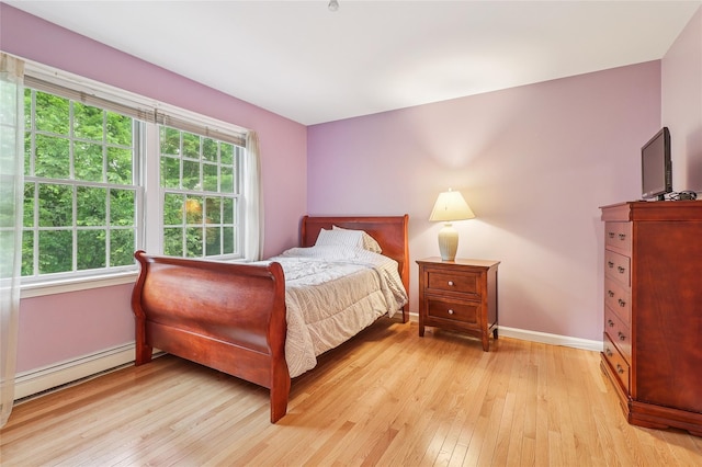 10 Jennifer Ln, Carmel, NY 10512 - bedroom with a baseboard radiator and light wood finished floors