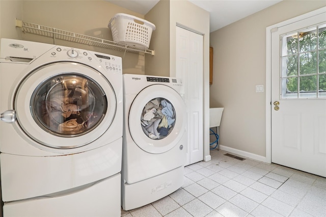 10 Jennifer Ln, Carmel, NY 10512 - washroom featuring washing machine and dryer and light tile patterned flooring