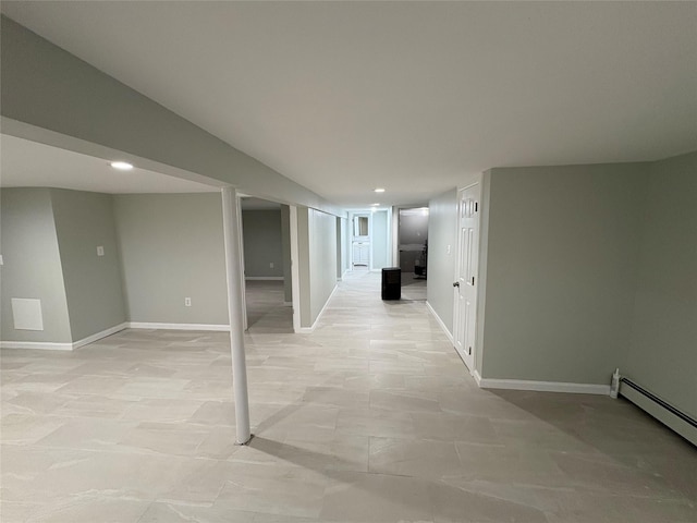 9 Holt St, Amityville, NY 11701 - finished basement featuring a baseboard heating unit and recessed lighting