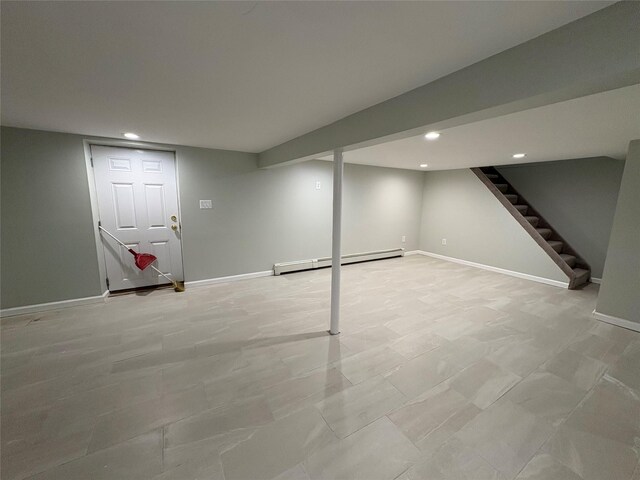 9 Holt St, Amityville, NY 11701 - finished below grade area featuring baseboard heating, recessed lighting, and stairs