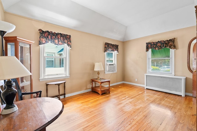 46-27 195th St, Flushing, NY 11358 - sitting room with radiator, hardwood / wood-style flooring, vaulted ceiling, and cooling unit
