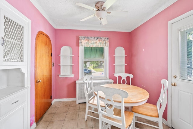 46-27 195th St, Flushing, NY 11358 - dining space featuring radiator, a textured ceiling, ceiling fan, ornamental molding, and light tile patterned flooring