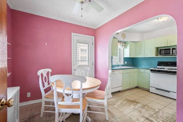 46-27 195th St, Flushing, NY 11358 - kitchen featuring white appliances, light tile patterned floors, arched walkways, ceiling fan, and crown molding