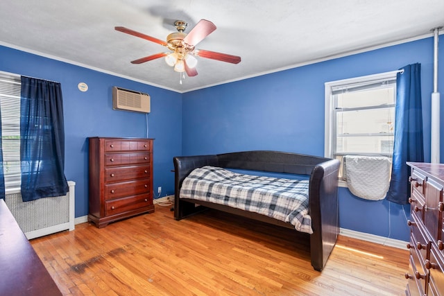 46-27 195th St, Flushing, NY 11358 - bedroom with a wall mounted air conditioner, light wood-type flooring, ceiling fan, and ornamental molding
