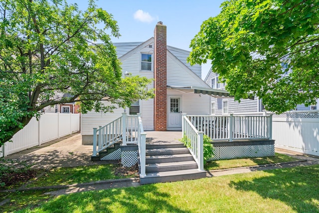 46-27 195th St, Flushing, NY 11358 - back of property with a chimney and a deck