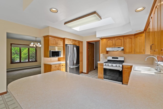 41-59 Fox Mountain Rd, Livingston Manor, NY 12758 - kitchen featuring stainless steel appliances, a baseboard heating unit, under cabinet range hood, light floors, and light countertops