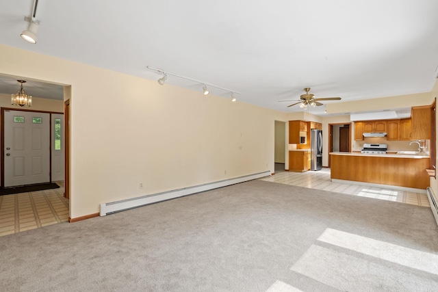 41-59 Fox Mountain Rd, Livingston Manor, NY 12758 - unfurnished living room with a baseboard heating unit, track lighting, light carpet, and a chandelier
