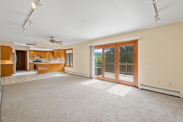 41-59 Fox Mountain Rd, Livingston Manor, NY 12758 - unfurnished living room featuring rail lighting, baseboard heating, light colored carpet, and ceiling fan