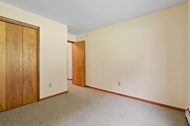 41-59 Fox Mountain Rd, Livingston Manor, NY 12758 - unfurnished bedroom with carpet floors, a baseboard heating unit, and a closet