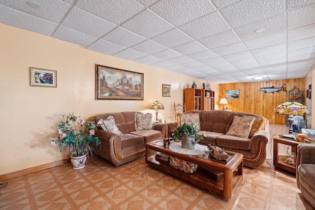 41-59 Fox Mountain Rd, Livingston Manor, NY 12758 - living room featuring a drop ceiling, light flooring, and wood walls