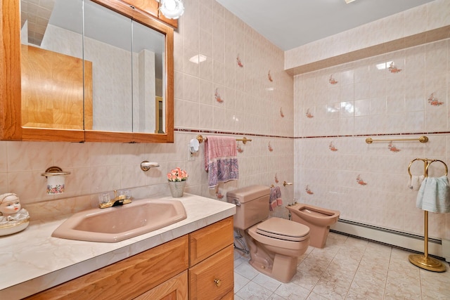 41-59 Fox Mountain Rd, Livingston Manor, NY 12758 - bathroom featuring tile walls, a baseboard radiator, a bidet, vanity, and tile patterned floors