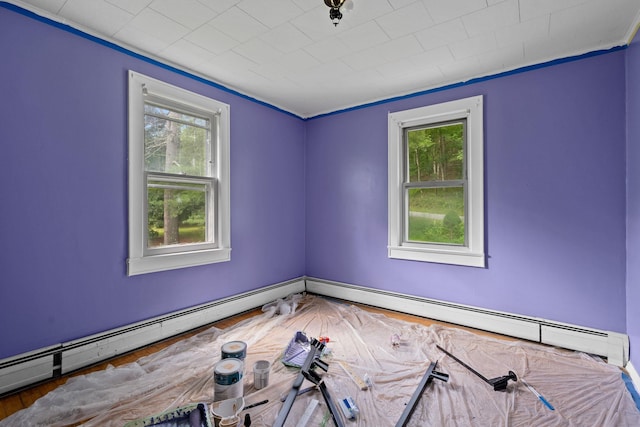41-59 Fox Mountain Rd, Livingston Manor, NY 12758 - spare room with healthy amount of natural light, a baseboard radiator, crown molding, and wood finished floors