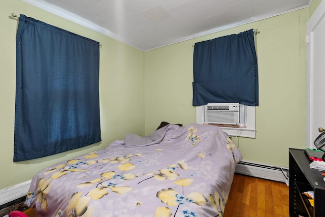 41-59 Fox Mountain Rd, Livingston Manor, NY 12758 - bedroom featuring a baseboard heating unit, wood finished floors, cooling unit, and ornamental molding