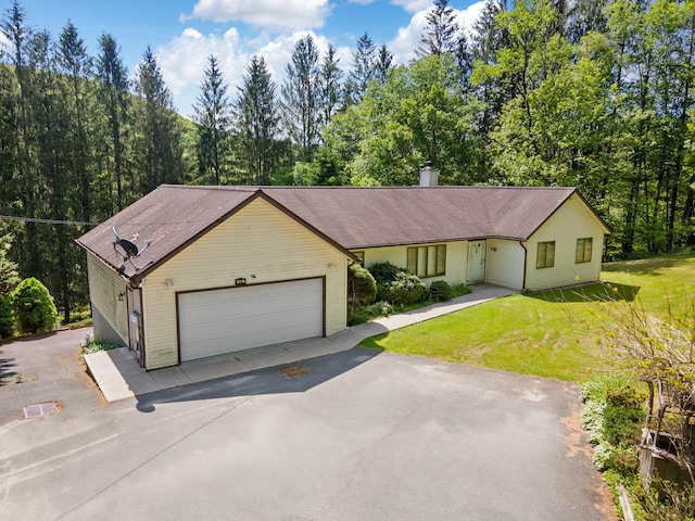 41-59 Fox Mountain Rd, Livingston Manor, NY 12758 - single story home featuring asphalt driveway, a garage, a chimney, a front lawn, and a shingled roof