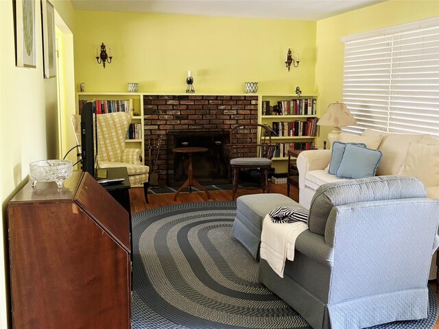 49 Sayres Path, Wainscott, NY 11975 - living area featuring wood finished floors and a brick fireplace