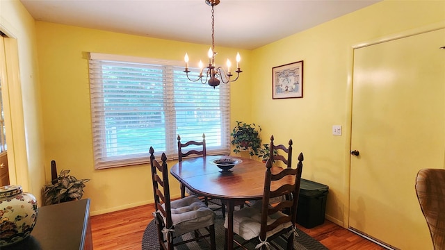 49 Sayres Path, Wainscott, NY 11975 - dining room with a chandelier, wood finished floors, and healthy amount of natural light