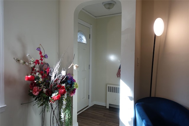 4120 Murdock Ave, Bronx, NY 10466 - entrance foyer featuring radiator heating unit, arched walkways, wood finished floors, and crown molding