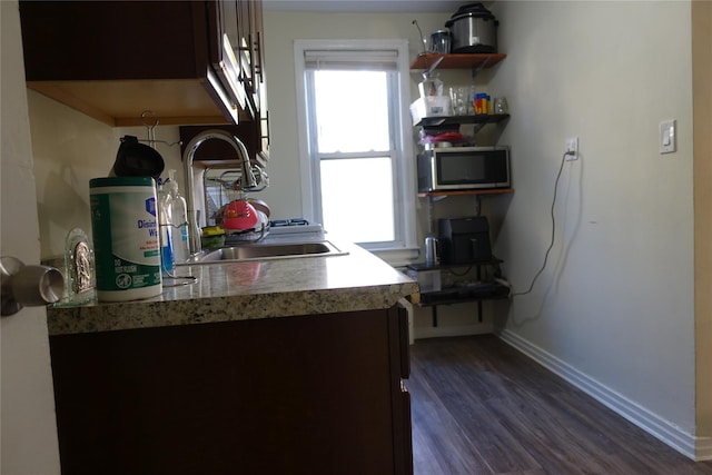 4120 Murdock Ave, Bronx, NY 10466 - kitchen with stainless steel microwave, dark wood-style floors, and light countertops