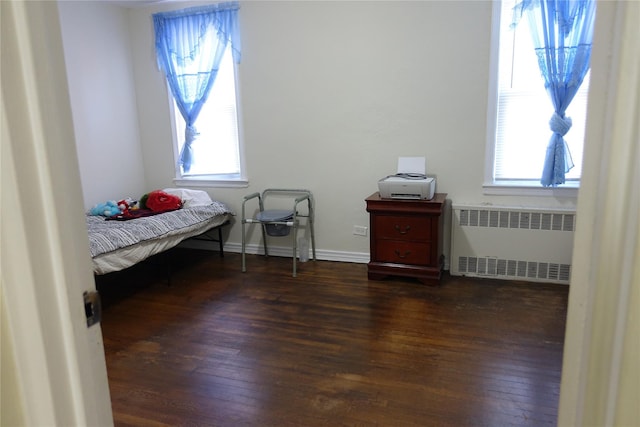 4120 Murdock Ave, Bronx, NY 10466 - bedroom with radiator, dark wood-type flooring, and multiple windows