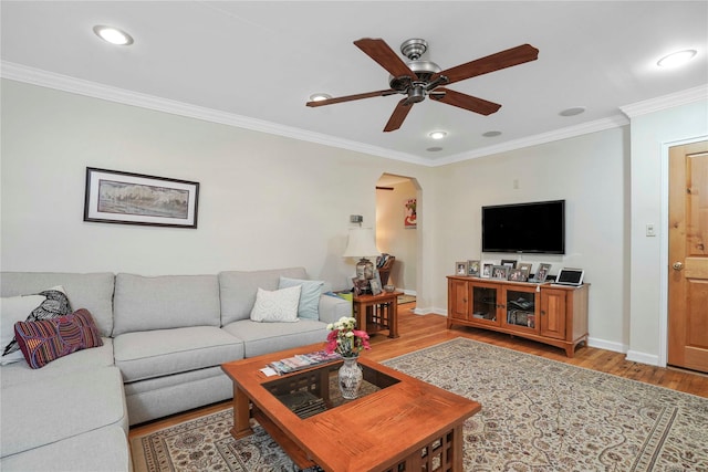 6404 78th St, Middle Village, NY 11379 - living area featuring light wood-type flooring, crown molding, a ceiling fan, arched walkways, and recessed lighting