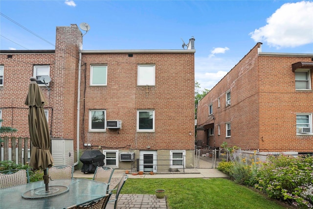 6404 78th St, Middle Village, NY 11379 - rear view of property featuring brick siding, a fenced backyard, a patio area, and a gate