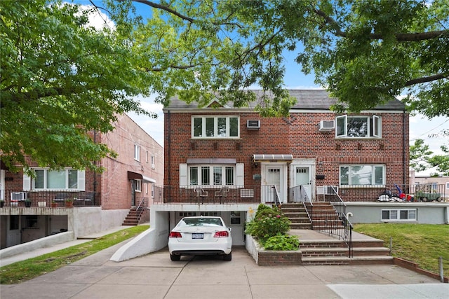 6404 78th St, Middle Village, NY 11379 - view of property with brick siding and concrete driveway
