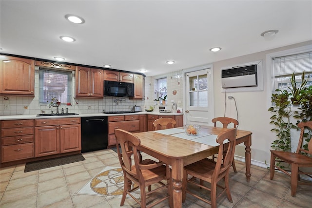 6404 78th St, Middle Village, NY 11379 - kitchen with black appliances, plenty of natural light, light countertops, decorative backsplash, and recessed lighting