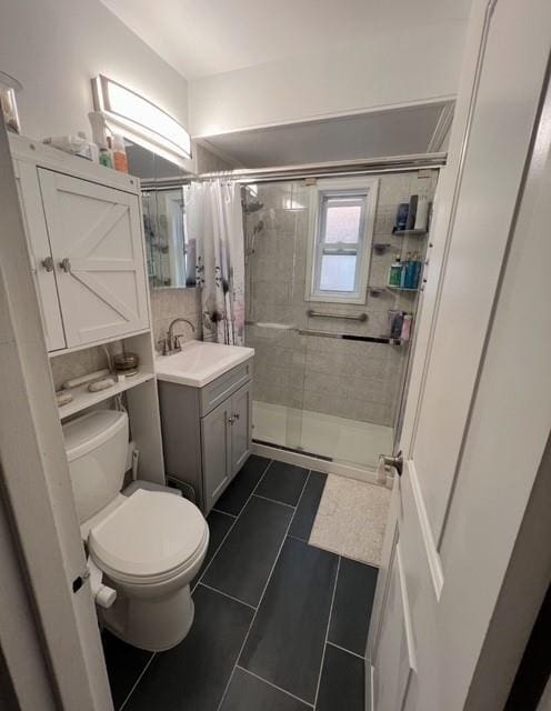 6404 78th St, Middle Village, NY 11379 - full bathroom with a stall shower, vanity, and tile patterned floors