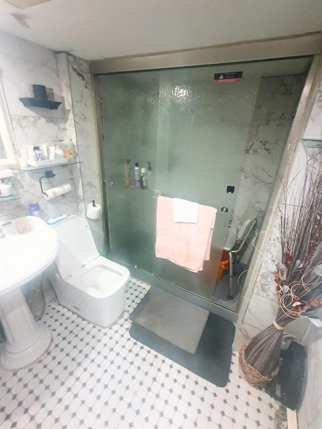 12826 Gotham Rd, South Ozone Park, NY 11420 - bathroom featuring a shower stall and toilet