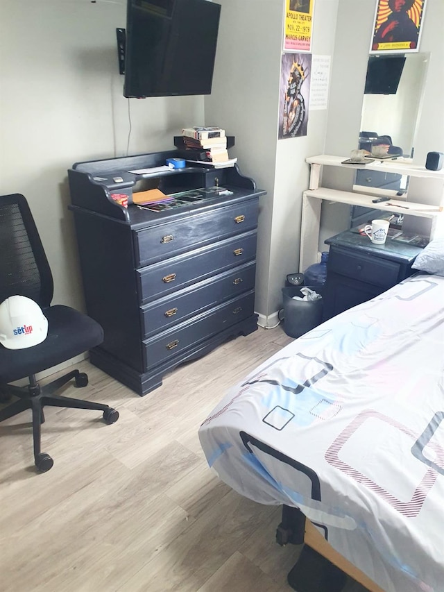 12826 Gotham Rd, South Ozone Park, NY 11420 - bedroom with light wood-style flooring