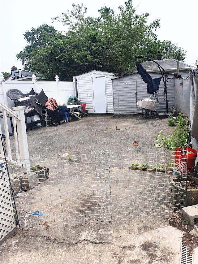 12826 Gotham Rd, South Ozone Park, NY 11420 - view of car parking featuring a storage unit