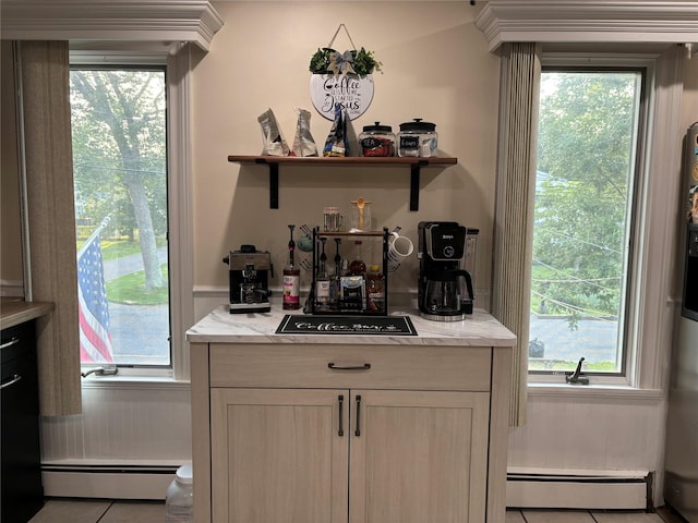 179 Clinton Ave, East Patchogue, NY 11772 - indoor dry bar featuring baseboard heating, tile patterned flooring, and healthy amount of natural light