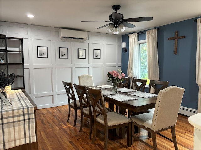 179 Clinton Ave, East Patchogue, NY 11772 - dining area with a wall mounted air conditioner, a decorative wall, a ceiling fan, a baseboard radiator, and wood finished floors