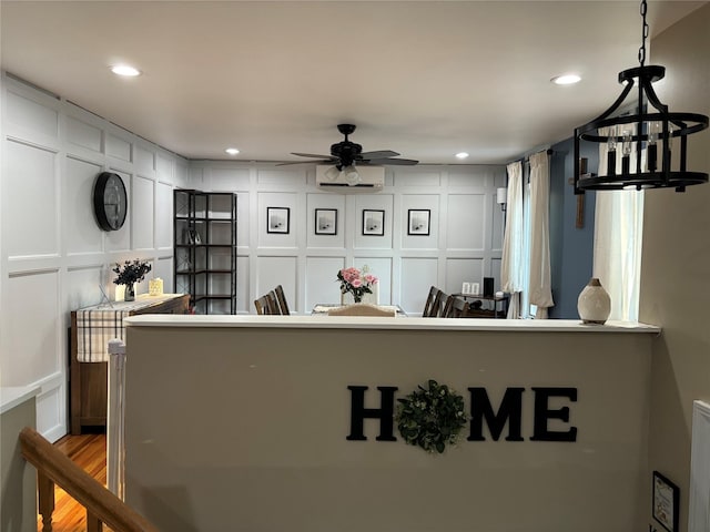179 Clinton Ave, East Patchogue, NY 11772 - reception area with a decorative wall, a ceiling fan, and recessed lighting