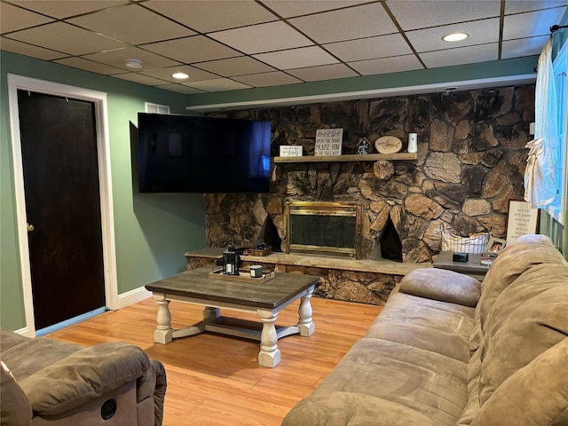179 Clinton Ave, East Patchogue, NY 11772 - living room featuring a paneled ceiling, wood finished floors, recessed lighting, and a fireplace